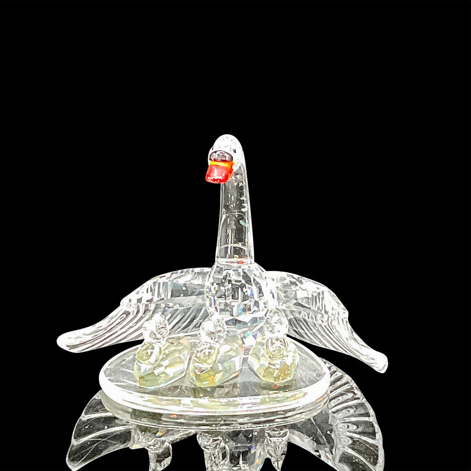 Swarovski Silver Crystal Figurine, Swan Family: Faceted crystal figurine swan mother protecting her three cygnets. Swarovski backstamp. This item has its original box: 4"H x 5"dia. Certificate of Authenticity included. Issued: 20th century Dimensio
