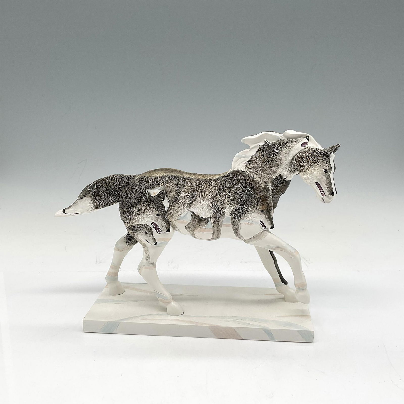 The Trail of Painted Ponies Figurine, Twilight Hunters: Beautiful gray and white wolf depiction designed with overlapping features on the pony. Westland Giftware backstamp. 12262. Artist: Lori Musil Issued: 2008 Dimensions: 8.25"L x 2.5"W x 6.25"H Manufact
