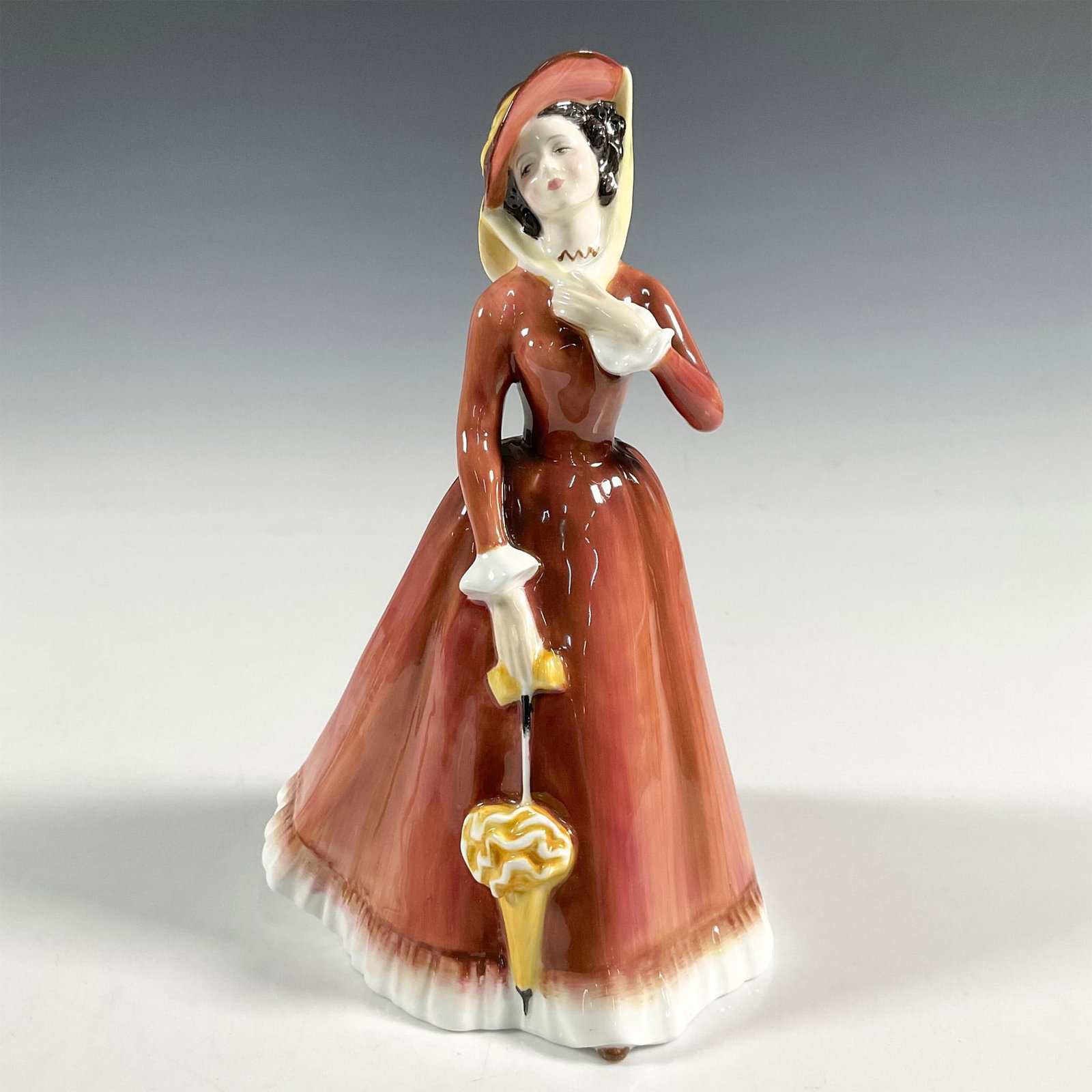 Julia - HN2705 - Royal Doulton Figurine: Artist: Peggy Davies Issued: 1975 - 1990 Dimensions: 7.5"H Manufacturer: Royal Doulton Country of Origin: England
