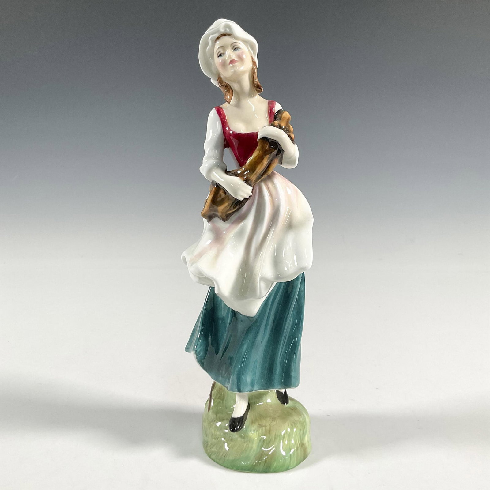 Lizzie - HN2749 - Royal Doulton Figurine: Artist: Douglas V. Tootle Issued: 1988 - 1991 Dimensions: 8.25"H Manufacturer: Royal Doulton Country of Origin: England