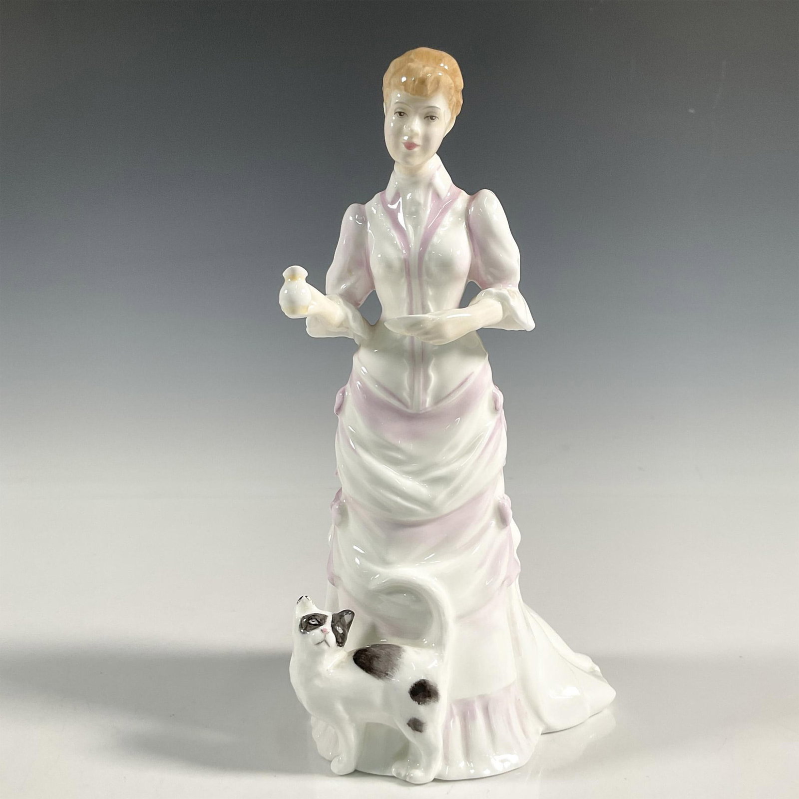 Lucy - HN3858 - Royal Doulton Figurine: Artist: Tim Potts Issued: 1997 - 1999 Dimensions: 8.5"H Manufacturer: Royal Doulton Country of Origin: England