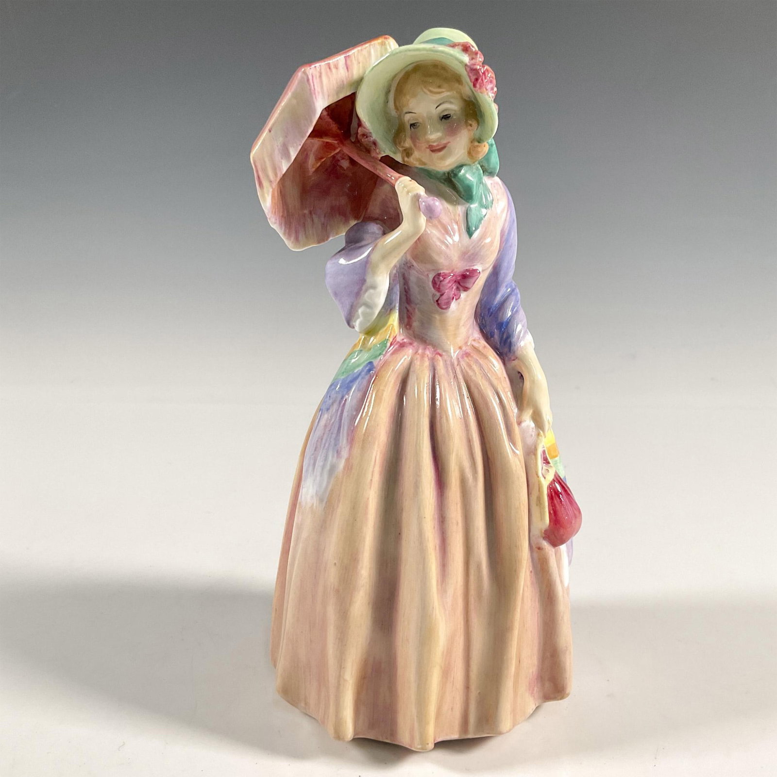 Miss Demure - HN1402 - Royal Doulton Figurine: Artist: Leslie Harradine Issued: 1930 - 1975 Dimensions: 7.5"H Manufacturer: Royal Doulton Country of Origin: England