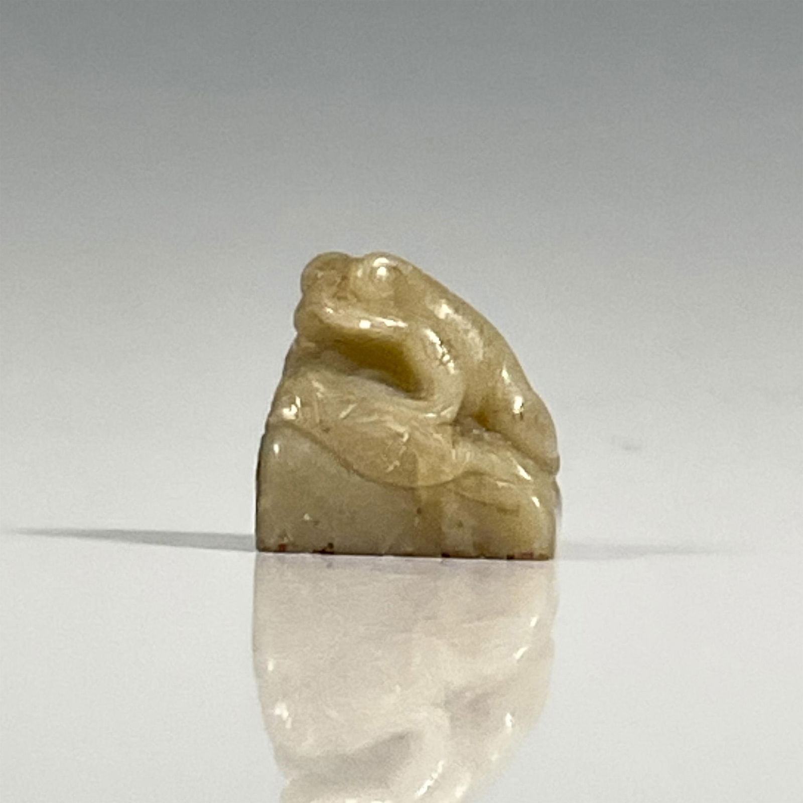 Antique Chinese Soapstone Frog Seal: A carved stone frog on a lily pad. Dimensions: 1.25"L x 1"W x 1.25"H Country of Origin: China