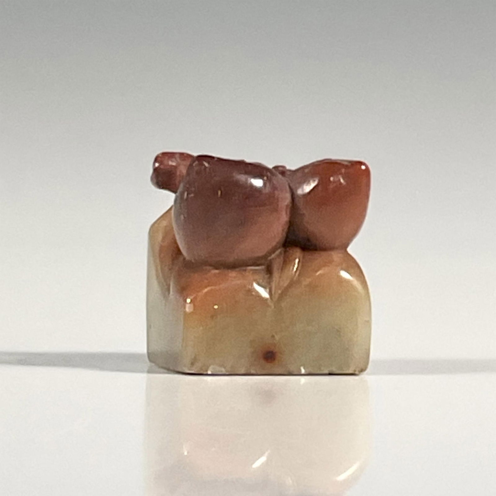 Antique Chinese Soapstone Peach Seal: Stone carving in a shape of two peaches. Dimensions: 1"L x 1"W x 1.25"H Country of Origin: China
