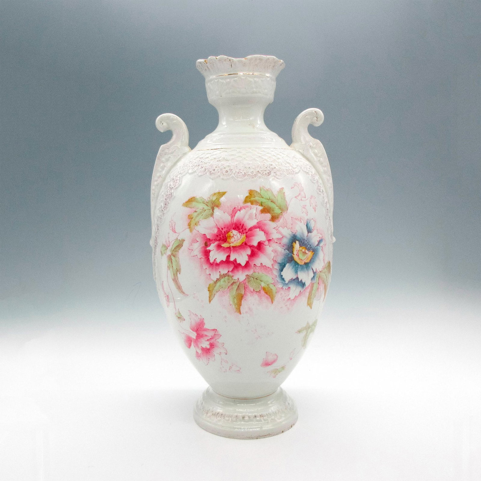 Vintage Large Ornate Porcelain Vase: Large vessel with raised molded design and hand painted florals on front and back. Issued: 20th century Dimensions: 14"H x 7"dia.