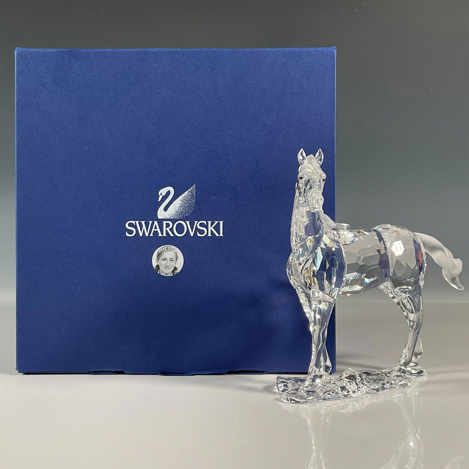 Swarovski Crystal Figurine, Mare Horse: Enchanting lead crystal horse figurine that was part of The Peaceful Countryside collection. Majestic animal, it shines in clear crystal with matte crystal tail and mane. Signed by artist. Swarovski e