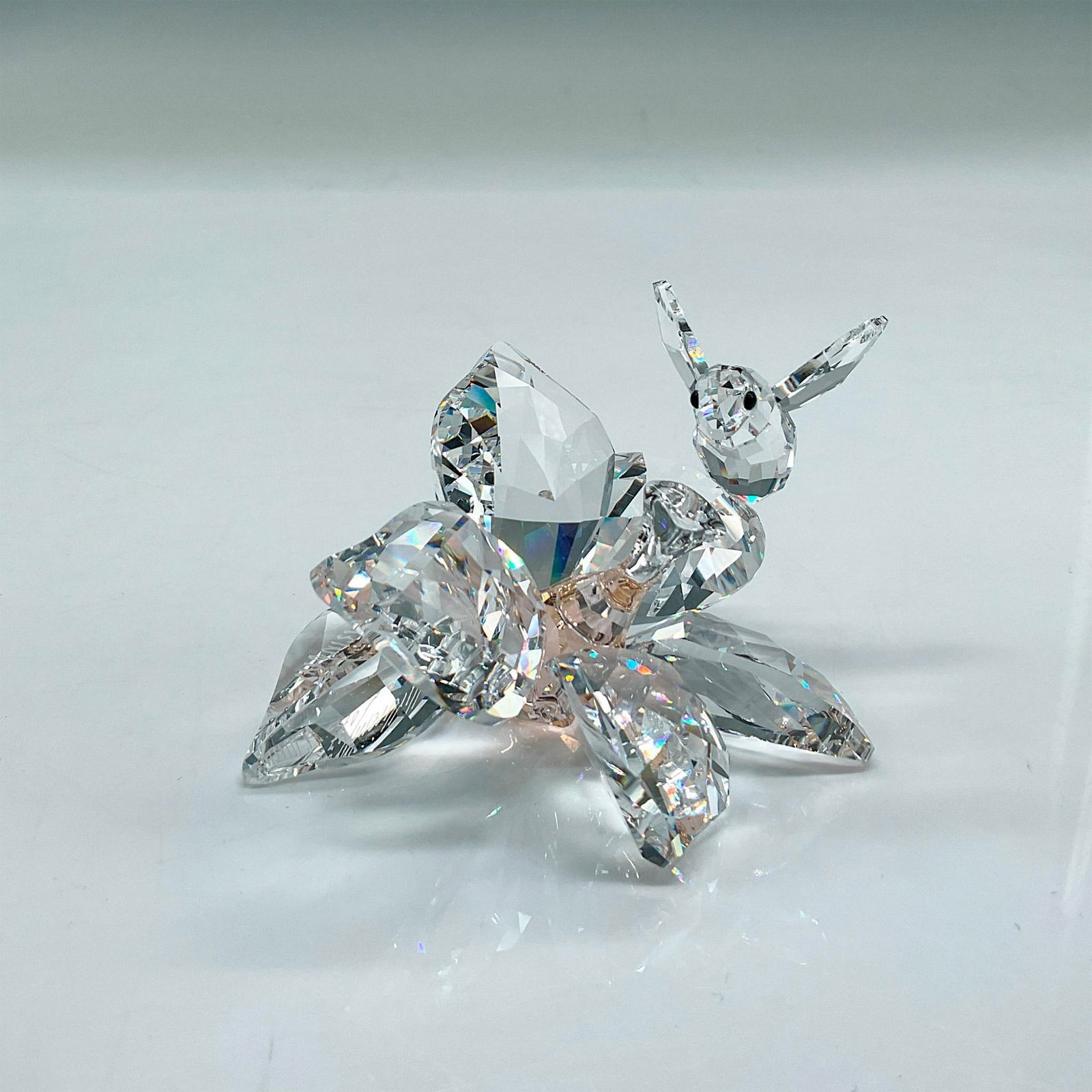 Swarovski Crystal Figurine, The Collector, Bee on Flower: Brilliant faceted crystal figure of a flower with a peach accent and a bee perched on a petal. Signed. Limited edition to celebrate the 20th anniversary of the SCS. Swarovski etched mark. Includes ori