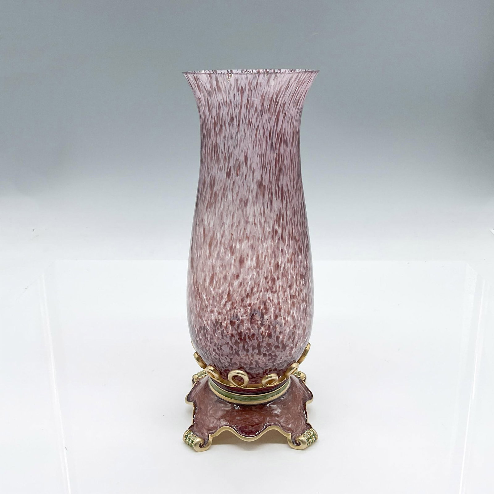 Jay Strongwater Enamel and Glass Vase: Beautiful purple swirl glass vase with decorative enamel and gold tone base embellished with Swarovski crystals. Jay Strongwater embossed on bottom. Artist: Jay Strongwater Issued: 20th century Dimens