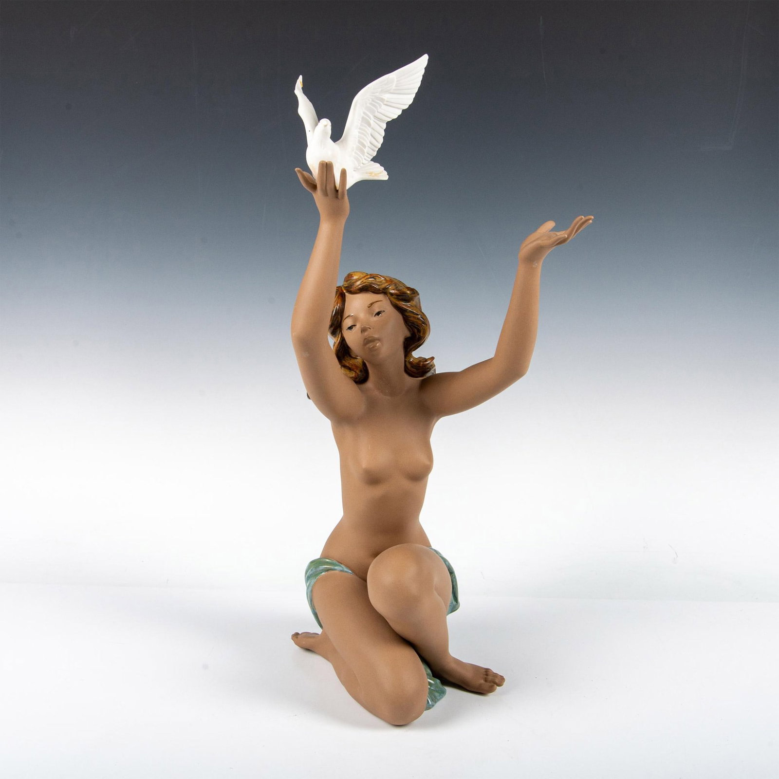Lladro Porcelain Figurine, Peace Offering 1013559: Lovely nude young woman offering dove of Peace. Lladro backstamp. Issued: 1985 - 2023 Dimensions: 8"L x 8.5"W x 21"H Manufacturer: Lladro Country of Origin: Spain