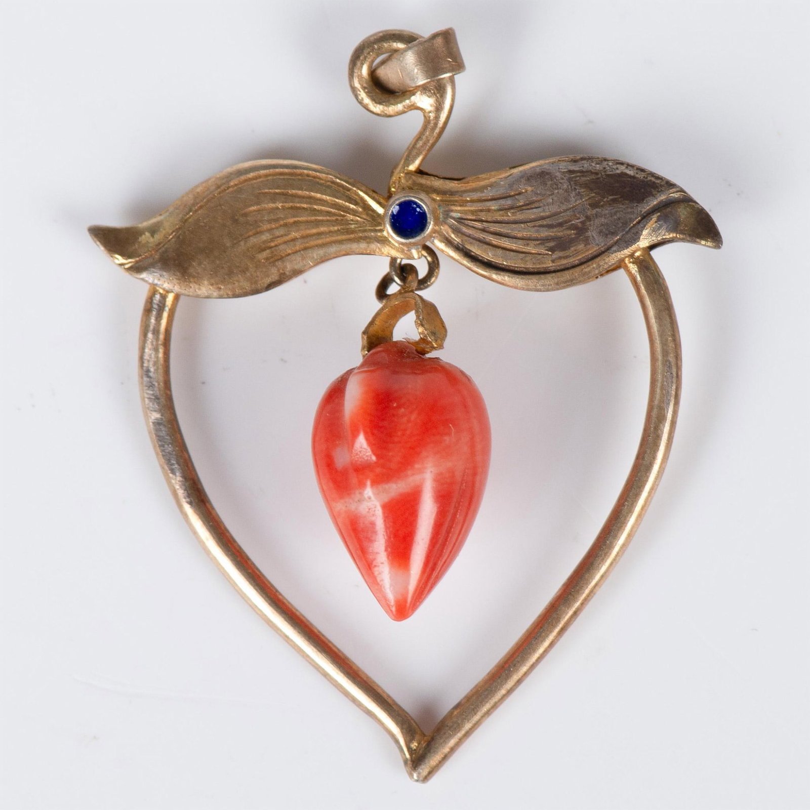 Vintage Gold Filled Coral Heart Shaped Pendant: Adorable very detailed pendant shaped as an open heart with hanging carved coral and cobalt blue enamel accent. Weight 4 grams. Dimensions: 1.5"H x 1.25"W