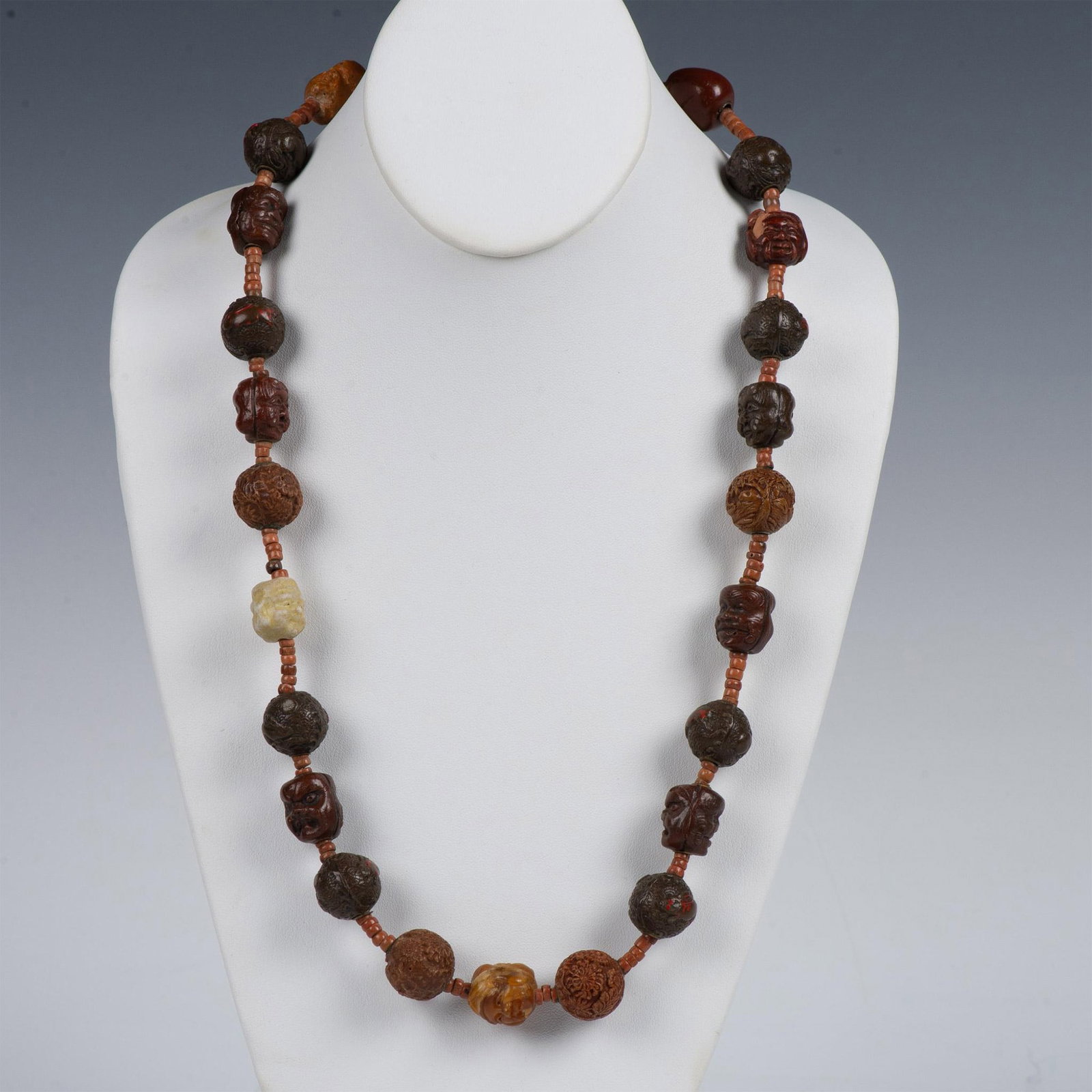 Chinese Carved Arhat Buddhism Bead Necklace: Ornately carved beads featuring different Chinese and Buddhist symbols. Dimensions: 27.5"L Country of Origin: China