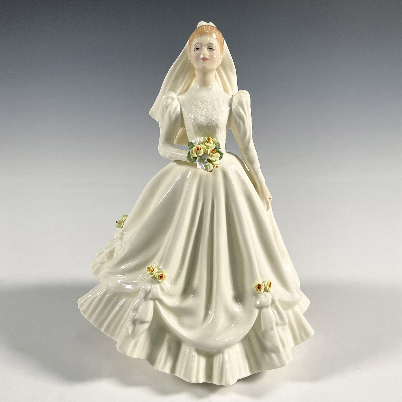 Bride - HN3285 - Royal Doulton Figurine: Artist: Douglas V. Tootle Issued: 1990 - 1996 Dimensions: 8.25"H Manufacturer: Royal Doulton Country of Origin: England