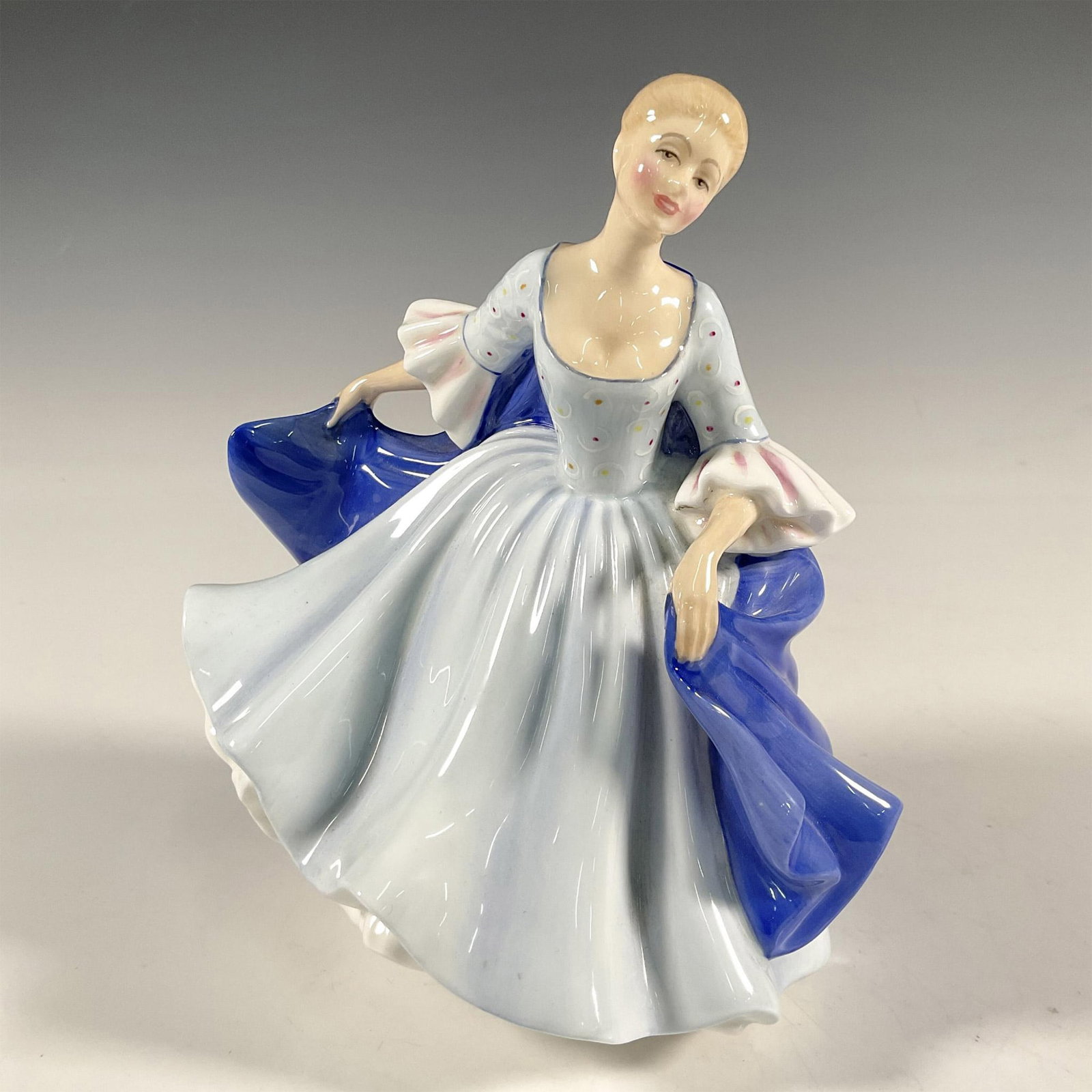 Dulcie - HN2305 - Royal Doulton Figurine: Artist: Peggy Davies Issued: 1981 - 1984 Dimensions: 7.25"H Manufacturer: Royal Doulton Country of Origin: England