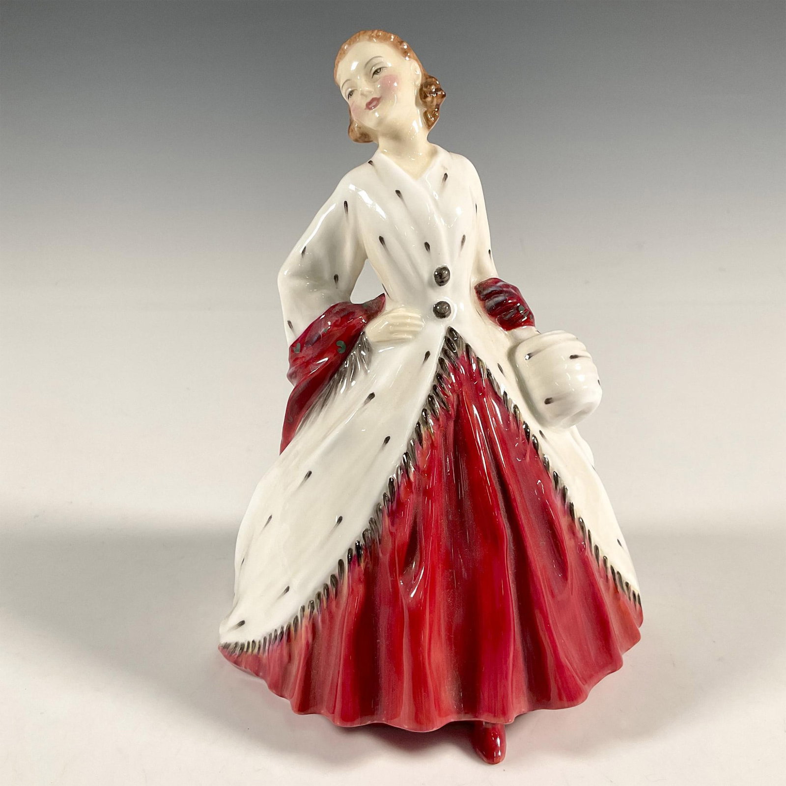 Ermine Coat - HN1981 - Royal Doulton Figurine: Artist: Leslie Harradine Issued: 1945 - 1967 Dimensions: 6.75"H Manufacturer: Royal Doulton Country of Origin: England