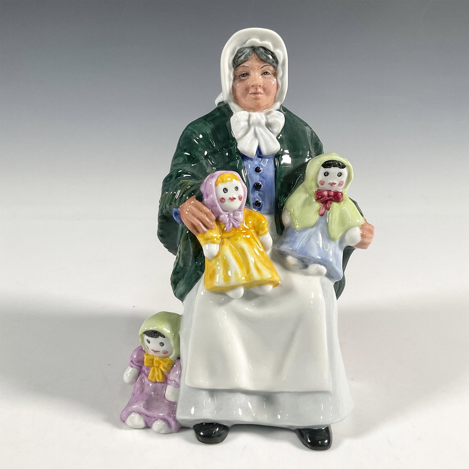 Rag Doll Seller - HN2944 - Royal Doulton Figurine: Artist: Robert Tabbenor Issued: 1983 - 1995 Dimensions: 7"H Manufacturer: Royal Doulton Country of Origin: England