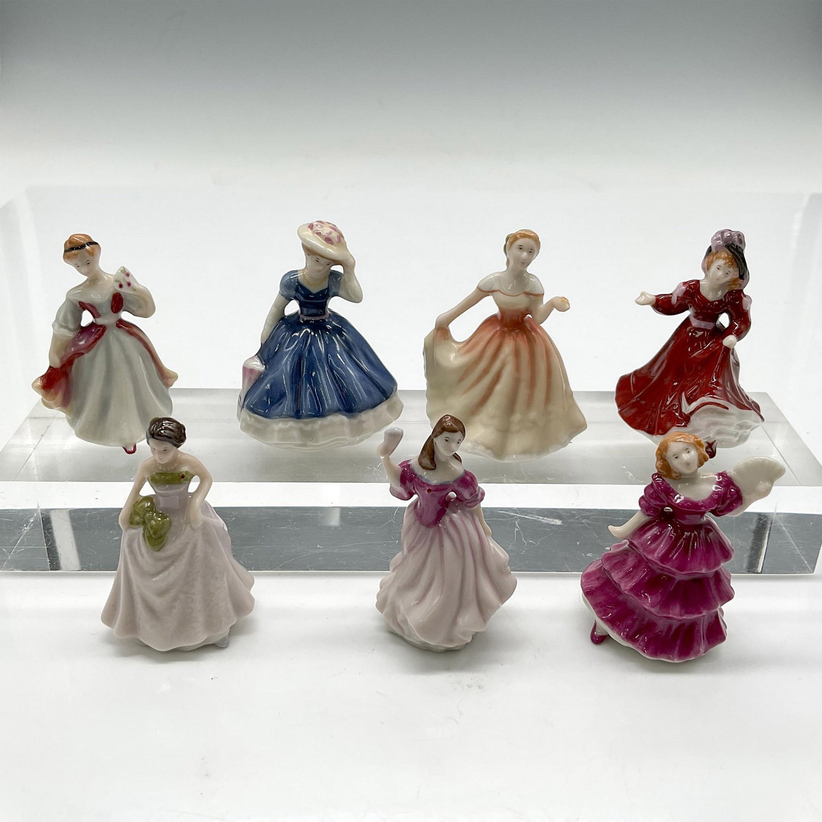 7pc Royal Doulton Bone China Miniature Figurines: Glossy, hand crafted, hand painted figures Jennifer 1994, Lauren 1999, Jessica 1997, Amy 1991, Patricia 1993, Mary 1992 and Deborah 1995. Issued: c. 2002 Dimensions: 1.5"L x 1.5"W x 2.25"H Manufacture