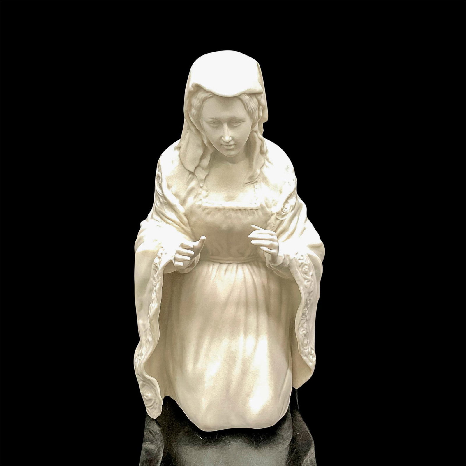 Boehm Christian Era Collection Figurine, Mary: Part of the Spirit of Bethlehem collection, beautifully detailed bisque colorless figural kneeling with arms outstretched. Boehm backstamp. Issued: 20th century Dimensions: 4.5"L x 5"W x 9"H Manufactu