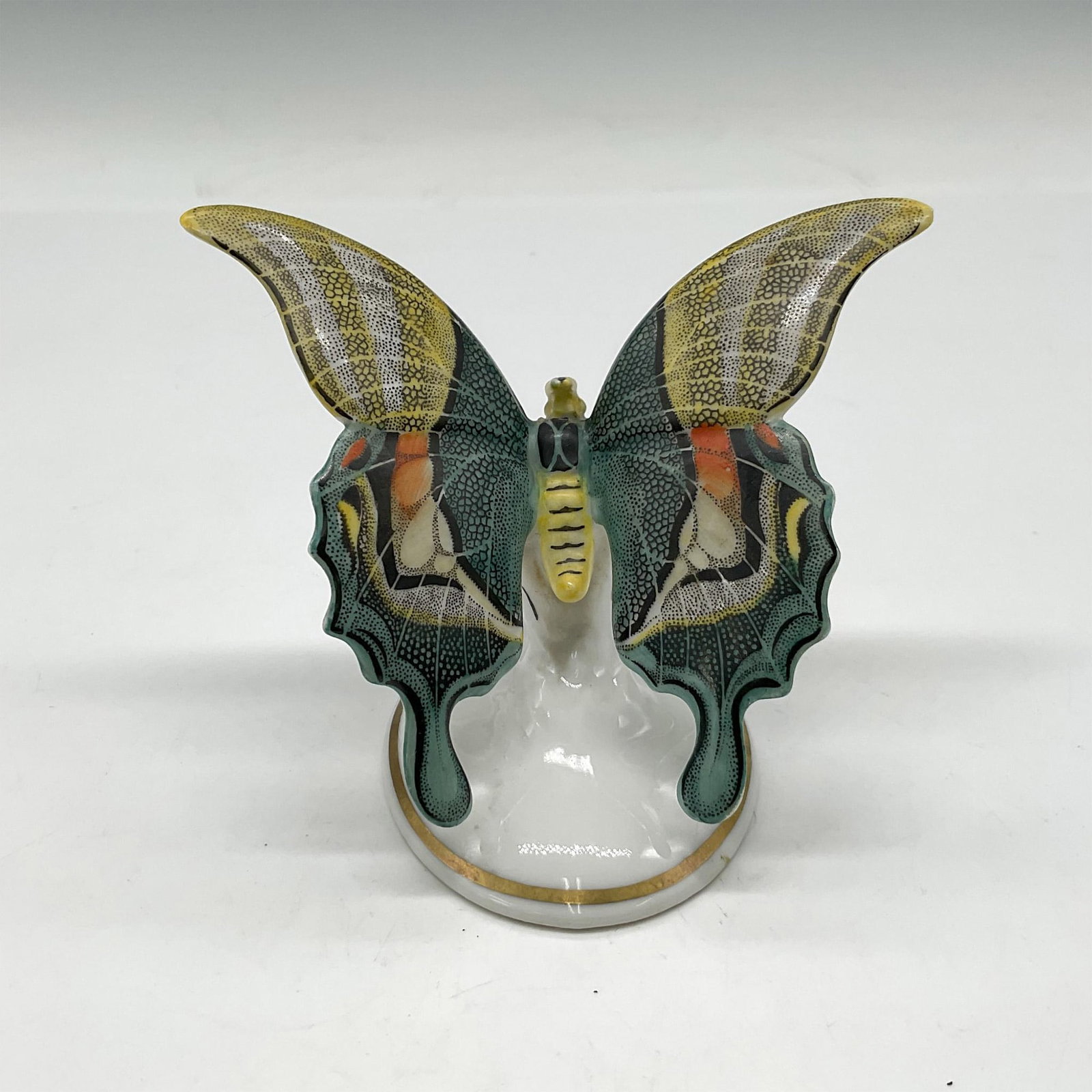 Rosenthal Porcelain Butterfly: Rare, beautifully hand painted yellow and turquoise wings with black accents throughout. Signed by artist. Rosenthal backstamp and sticker. Artist: E. Demel Issued: 20th century Dimensions: 4"L x 2.75