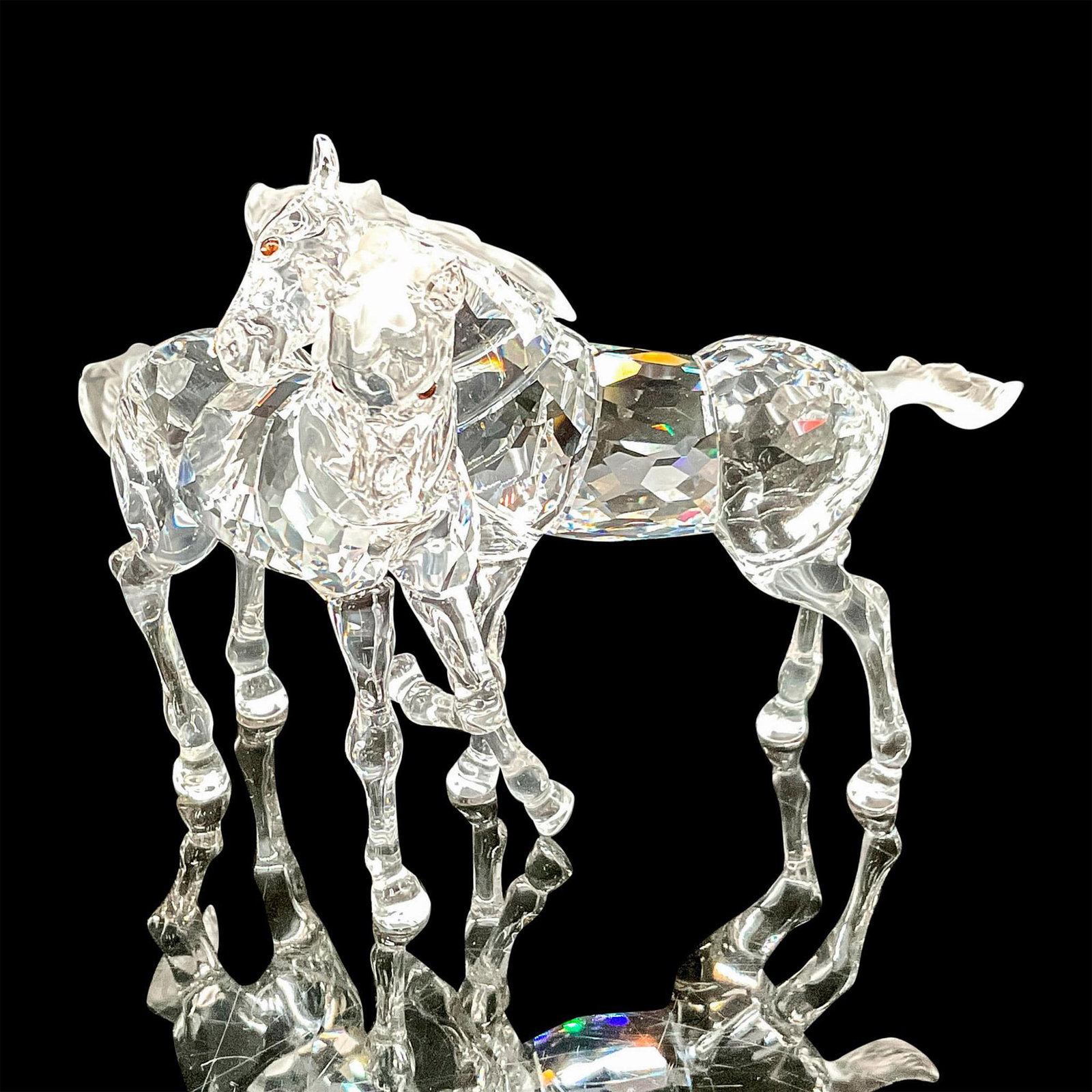 Swarovski Crystal Figurine, Foals: Part of the Peaceful Countryside theme group. Clear crystal figurine with frosted mane, tails and smoky topaz crystal inset eyes. Swarovski backstamp. 7612 000 003. This item has its original box: 7.2