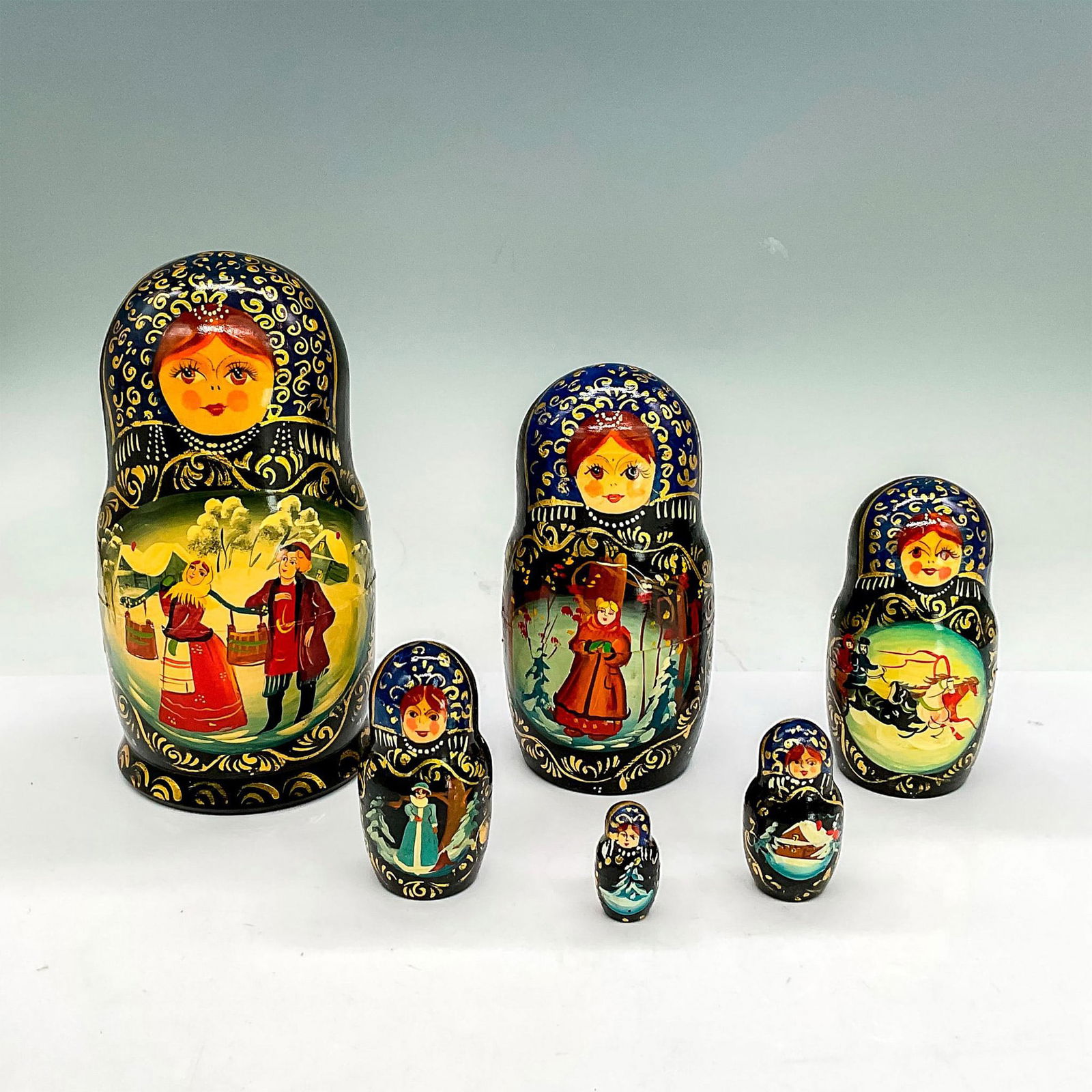 Russian Hand Painted Nesting Dolls: Beautiful and colorful 6 piece nesting dolls painted in festive winter scenes. Created in the Fedoskino region. Tallest doll is 7"H x 3.5"W. Country of Origin: Russia