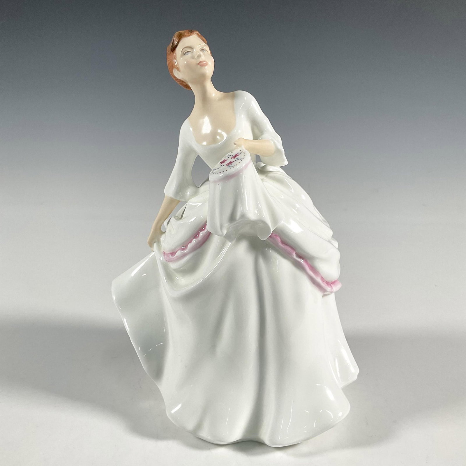 Carol HN2961 - Royal Doulton Figurine: Artist: Pauline Parsons Issued: 1982 - 1995 Dimensions: 7.5"H Manufacturer: Royal Doulton Country of Origin: England