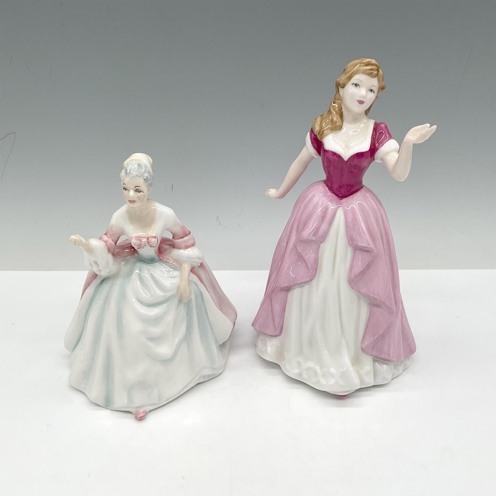 2pc Royal Doulton Pretty Ladies Figurines, HN4774 + HN3310: Hand painted, glossy petite and mini figures includes Vicky HN4774 and Diana HN3310. Royal Doulton backstamp. Largest piece: 3.25"L x 3.5"W x 6"H. Issued: 1985, 2004 Manufacturer: Royal Doulton Countr
