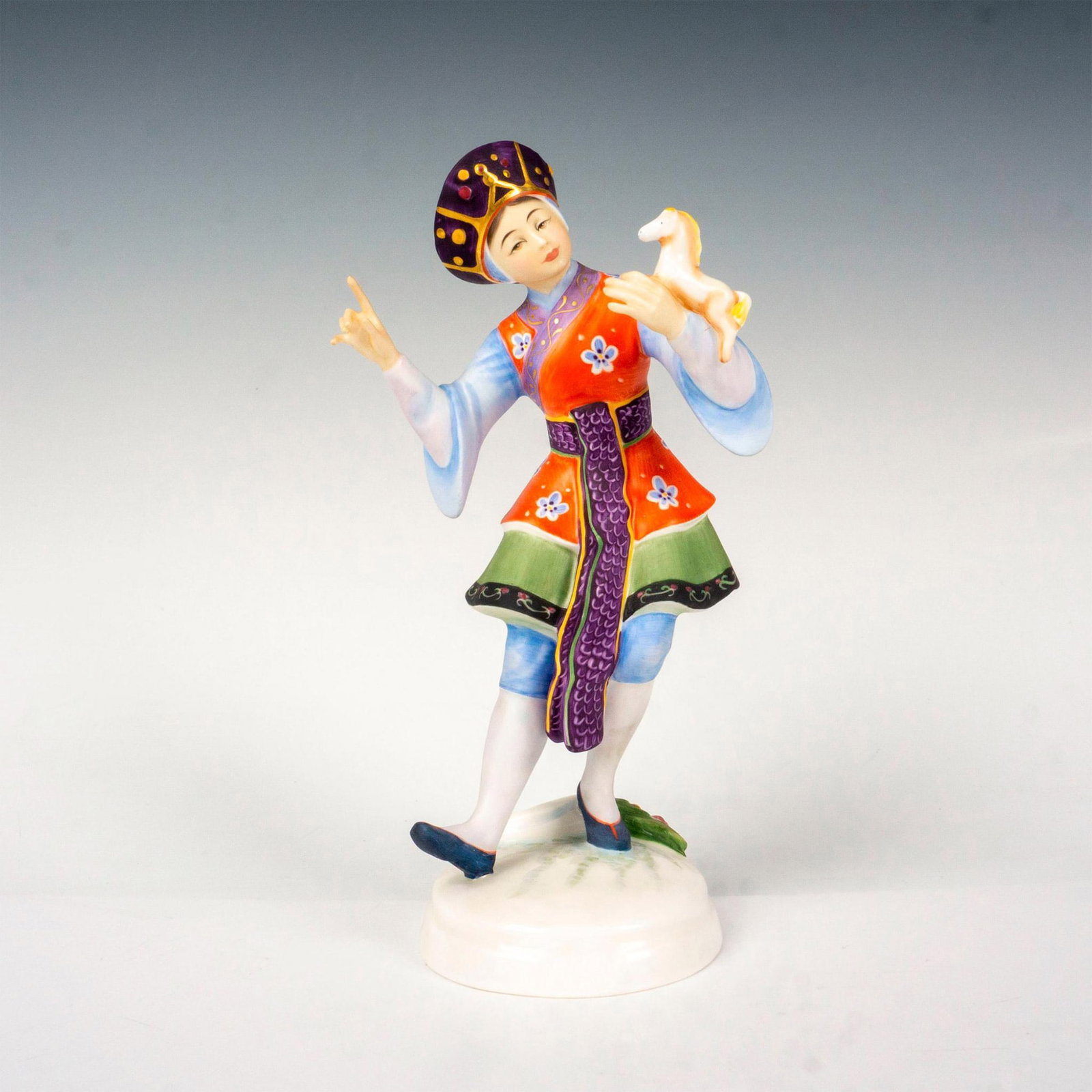 Chinese Dancer HN2840 - Royal Doulton Figurine: Limited edition bone china, modeled in red, green, purple, and lavender coloration. Royal Doulton backstamp. Artist: Peggy Davies Issued: 1980 Dimensions: 9"H Edition Number: 194 Edition Size: 750