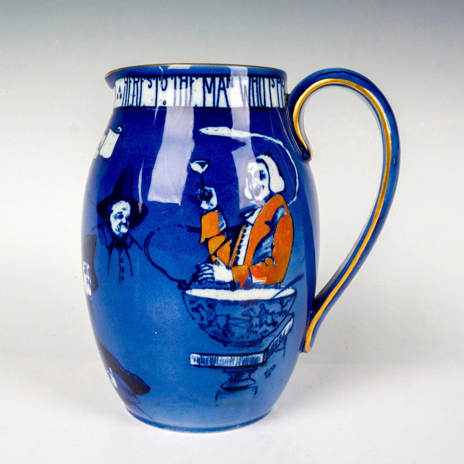 Royal Doulton Series Ware Motto Jug, Tavern Toasting: Cornflower-blue ground decorated with man toasting and a motto; gilded gold trim. Royal Doulton backstamp. Issued: c. 1903 Dimensions: 5.25"L x 4"W x 6"H Manufacturer: Royal Doulton Country of Origin: