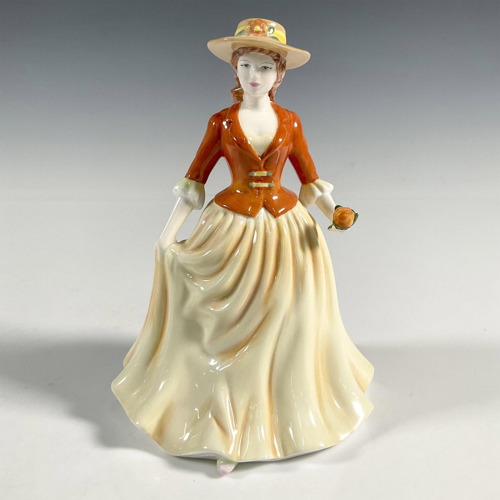 Autumn Stroll - HN4588 - Royal Doulton Figurine: Artist: C. Jackson Issued: 2006 - 2006 Dimensions: 6"H Manufacturer: Royal Doulton Country of Origin: England