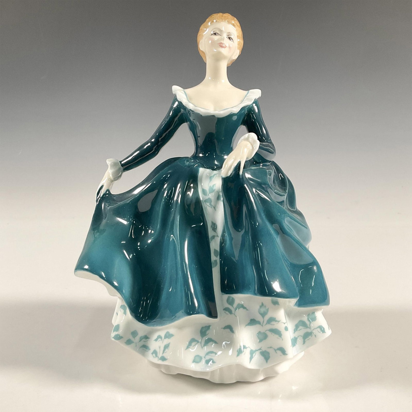 Janine - HN2461 - Royal Doulton Figurine: Artist: John Bromley Issued: 1971 - 1995 Dimensions: 7.5"H Manufacturer: Royal Doulton Country of Origin: England
