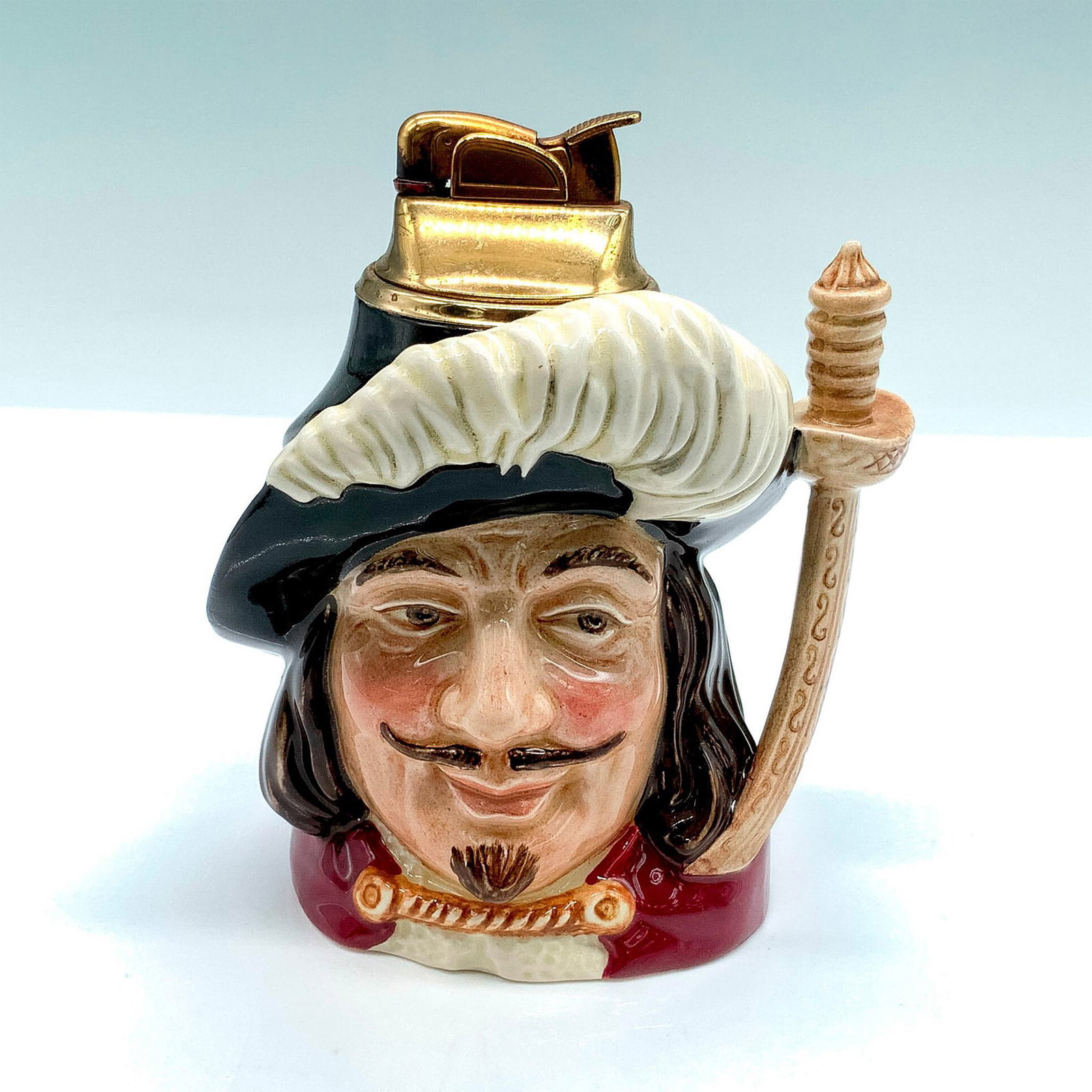Royal Doulton Character Lighter, Porthos: Porcelain character lighter depicting one of the much-loved Three Musketeers in the 1844 novel by Alexandre Dumas, Porthos. One of the Three Musketeers was included in the early backstamp to indicate 