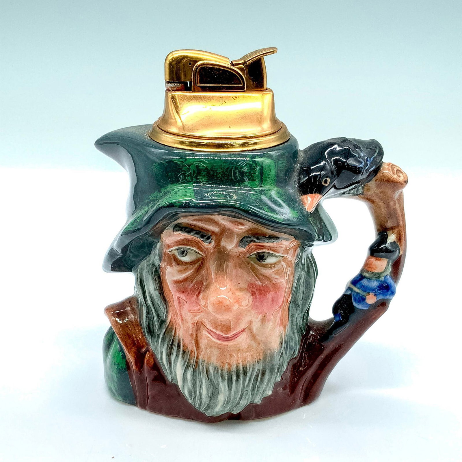 Royal Doulton Character Lighter, Rip Van Winkle: Porcelain character lighter depicting a character from a legend told by Washington Irving in 1820. The lighter is removeable and refillable. Glossy finish; Royal Doulton backstamp. Artist: Geoff Blowe