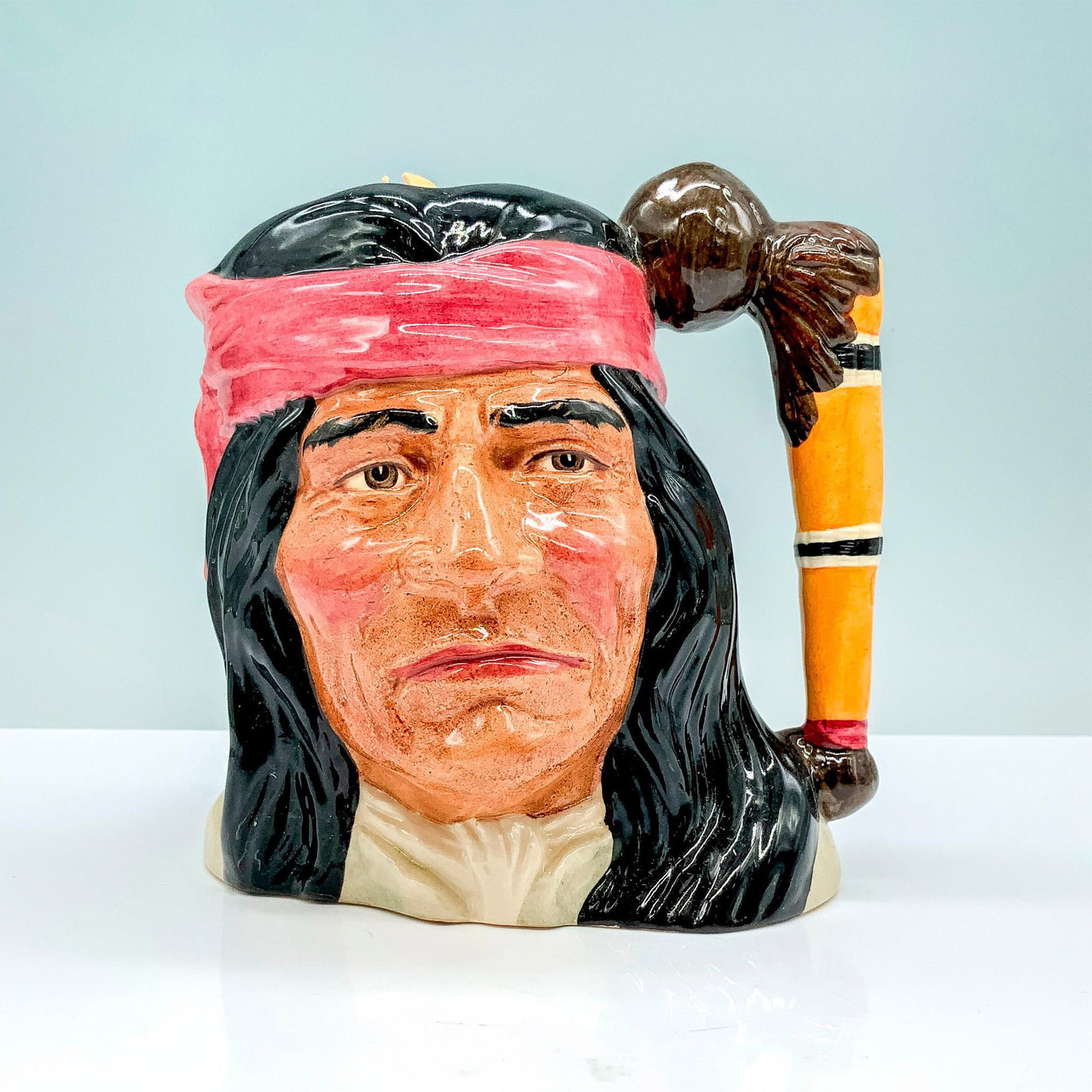 Geronimo D6733 - Odd Size - Royal Doulton Character Jug: Black, red and white coloration. Royal Doulton backstamp. Artist: Stanley J. Taylor Issued: 1985 - 1989 Dimensions: 5.5"H Manufacturer: Royal Doulton Country of Origin: England