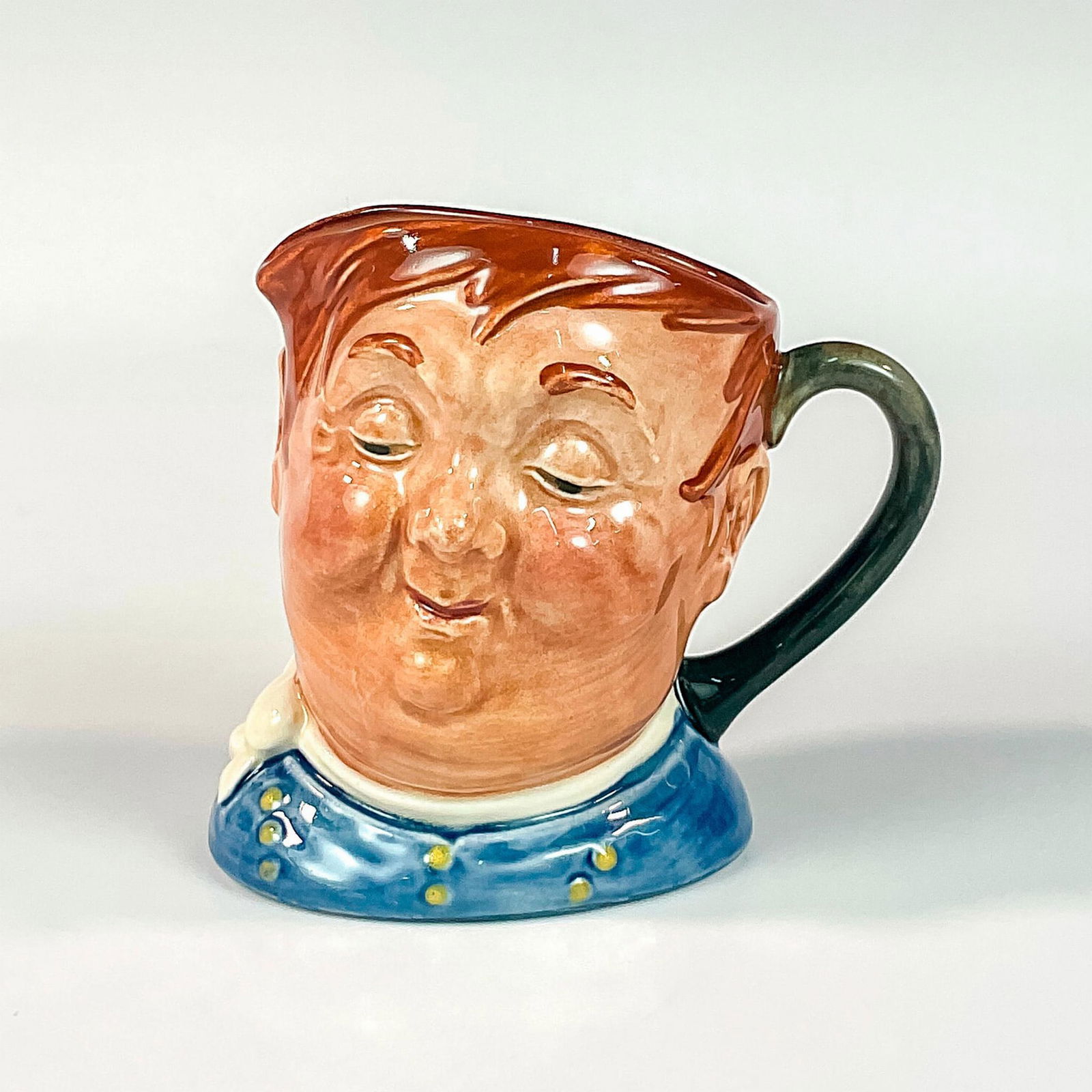 Fat Boy D5840 - Small - Royal Doulton Character Jug: Blue shirt; white scarf. Another wonderful Dickens character , Joe, the Fat Boy, was the lazy glutton who worked as servant to Mr. Wardle in " The Pickwick Papers." Royal Doulton backstamp. Artist: Le