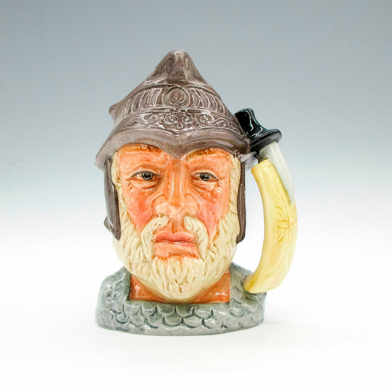 Gladiator D6553 - Small - Royal Doulton Character Jug: Brown helmet; grey armor. Royal Doulton backstamp. Artist: Max Henk Issued: 1961 - 1967 Dimensions: 4.25"H Manufacturer: Royal Doulton Country of Origin: England