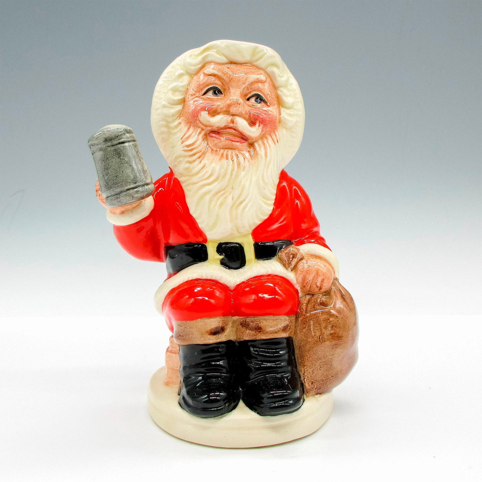 Father Christmas D6940 - Royal Doulton Toby Jug: Dimensions: 4.5"L x 3"W x 5"H Edition Number: 619 Edition Size: 3500 Manufacturer: Royal Doulton Country of Origin: England