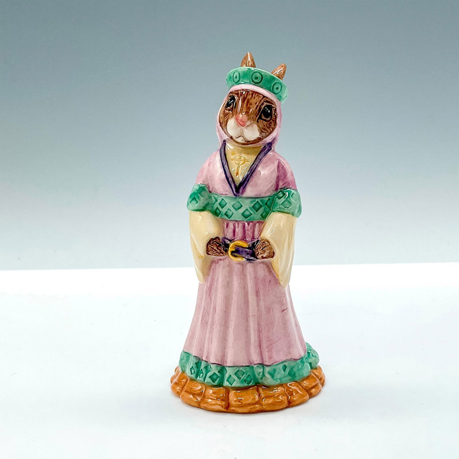 Maid Marion DB245 - Royal Doulton Bunnykins: Box included. Box measures approximately 2.5"L x 3.5"W x 5.75"H. Artist: M. Alcock Issued: 2001 - 2003 Dimensions: 4.25"H Manufacturer: Royal Doulton Country of Origin: England