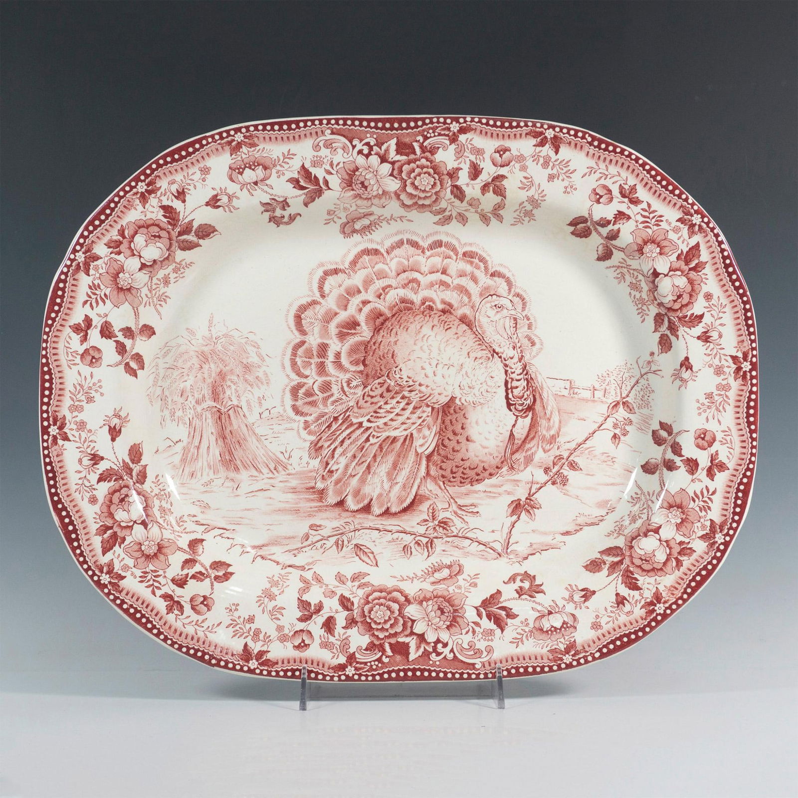 Royal Staffordshire Dinnerware, Red and White Turkey Platter: Featuring a gorgeous serving platter in Tonquin Red with a white background, showcasing a majestic turkey at the center and delicate floral trim. Backstamp says Royal Staffordshire Dinnerware by Clari