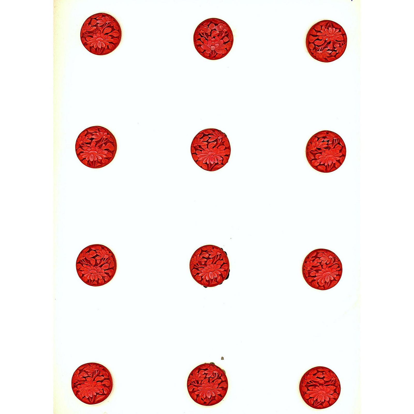 A card of division one red Cinnabar buttons (1 of 2)