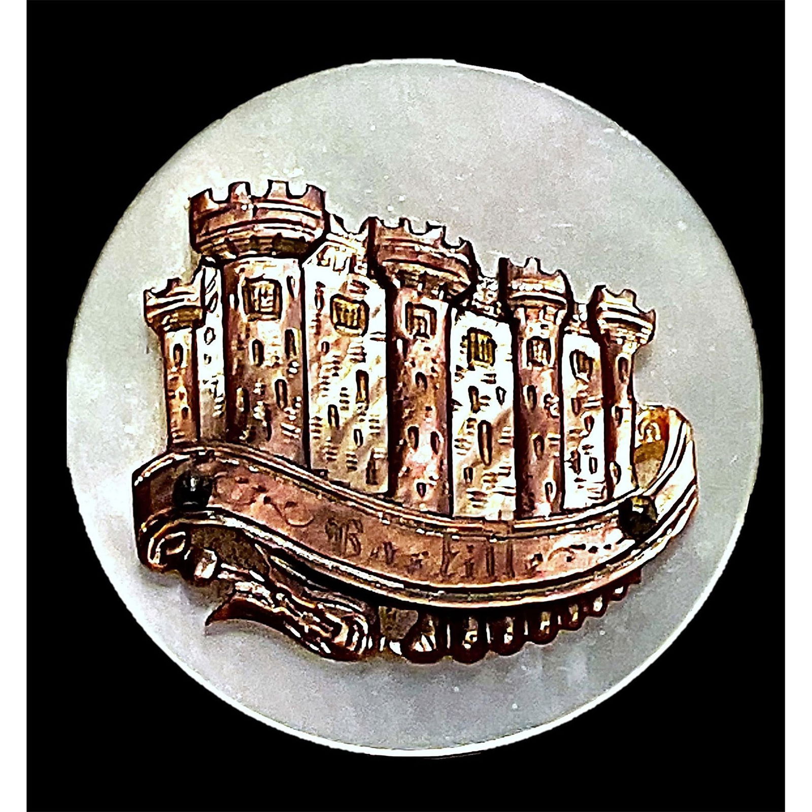 A division one carved architectural pearl button: 1 Large 19th century brown shaded shell button. From the collection of the late Shirley Case of Missouri who was known as the pearl queen is this beautifully carved brown shaded pearl of buildings att