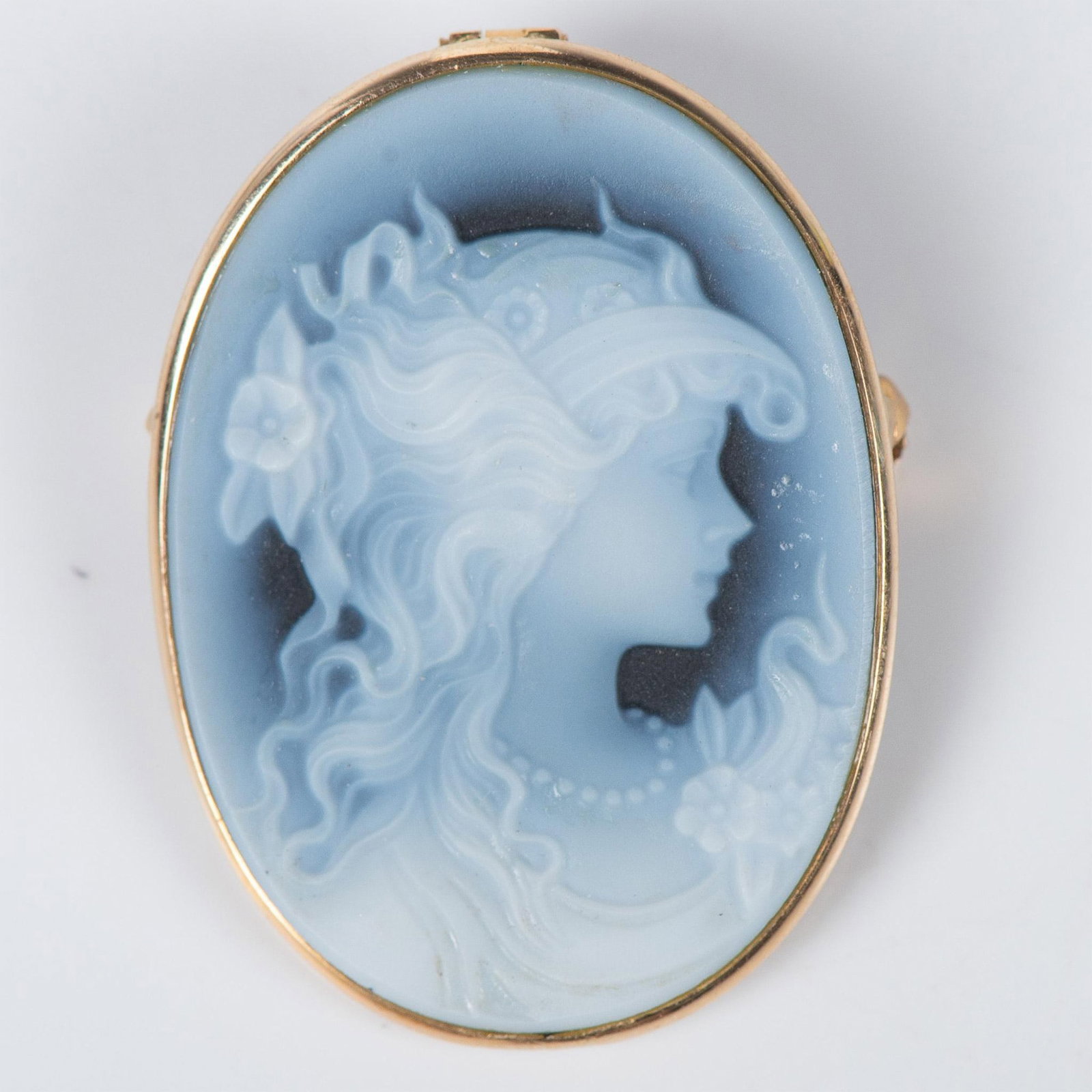 14k Gold and Blue Agate Cameo: This beautiful girl is carved in blue agate surrounded by 14k gold. Quite airy with long flowing hair and a pearl necklace. Can be worn as a pendant or a brooch. Backstamp NA 14k. Issued: 20th century