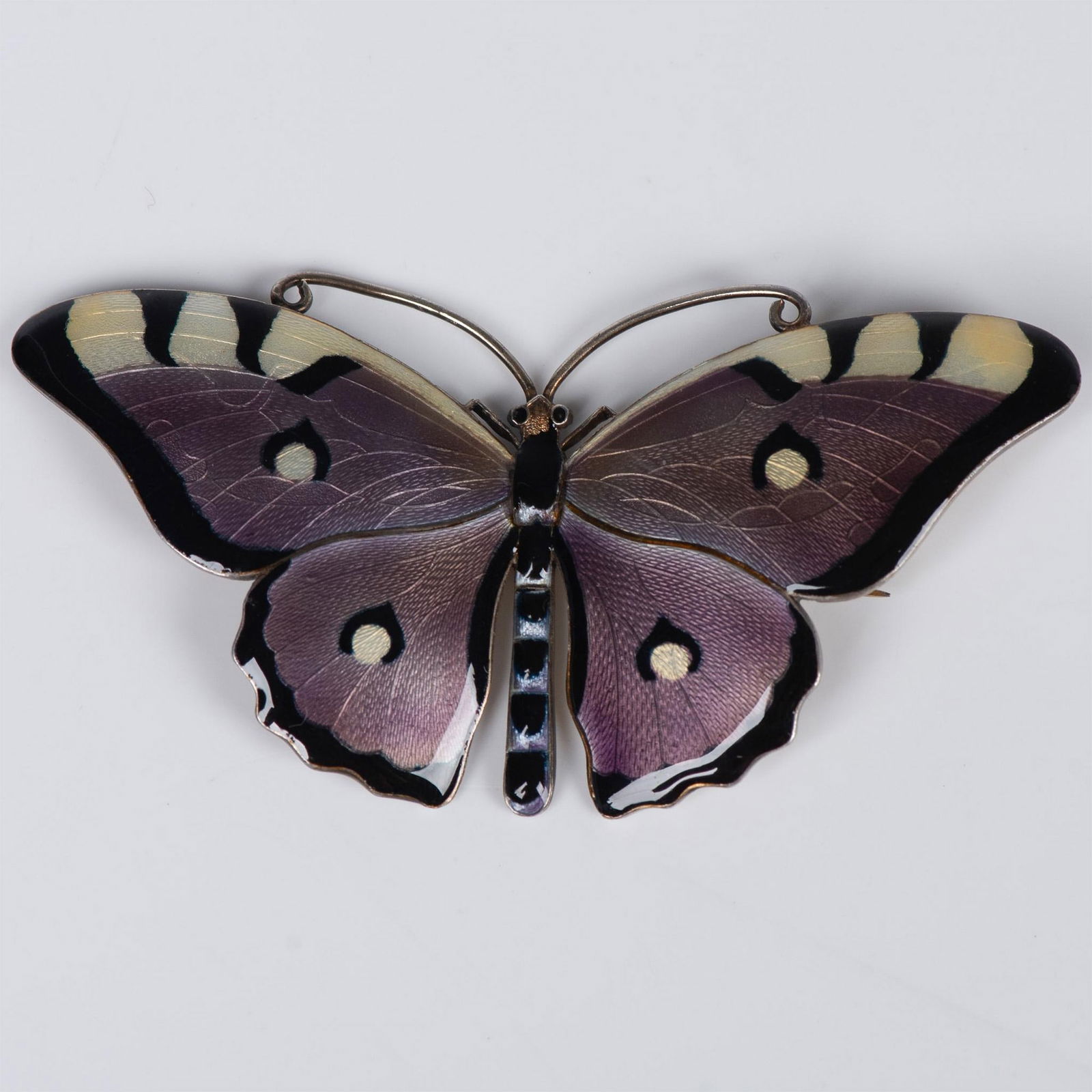 CG Hallberg Sterling Silver and Enamel Butterfly: Fabulous purple, yellow and black butterfly with a touch of blue in the body. The wings have intricate veining details. The back and antennas are a gold tone sterling silver. Backstamp C.G. Hallberg w
