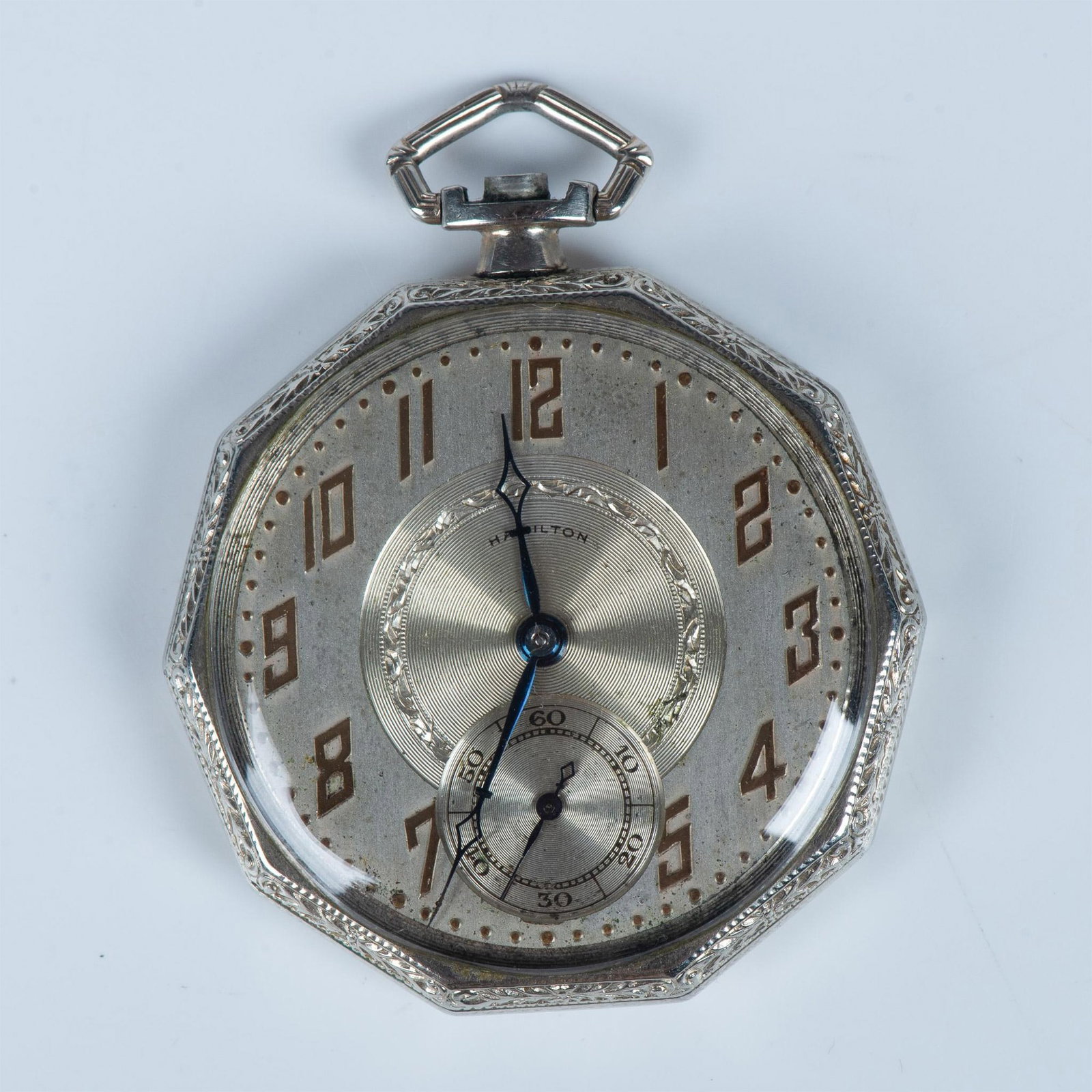 Hamilton Decagon Open Face Pocket Watch: Lovely vintage piece with ornate bezel and FCB monogramed on the back. The face is quite beautiful as well. 1.75"dia. Issued: 20th century Manufacturer: Hamilton