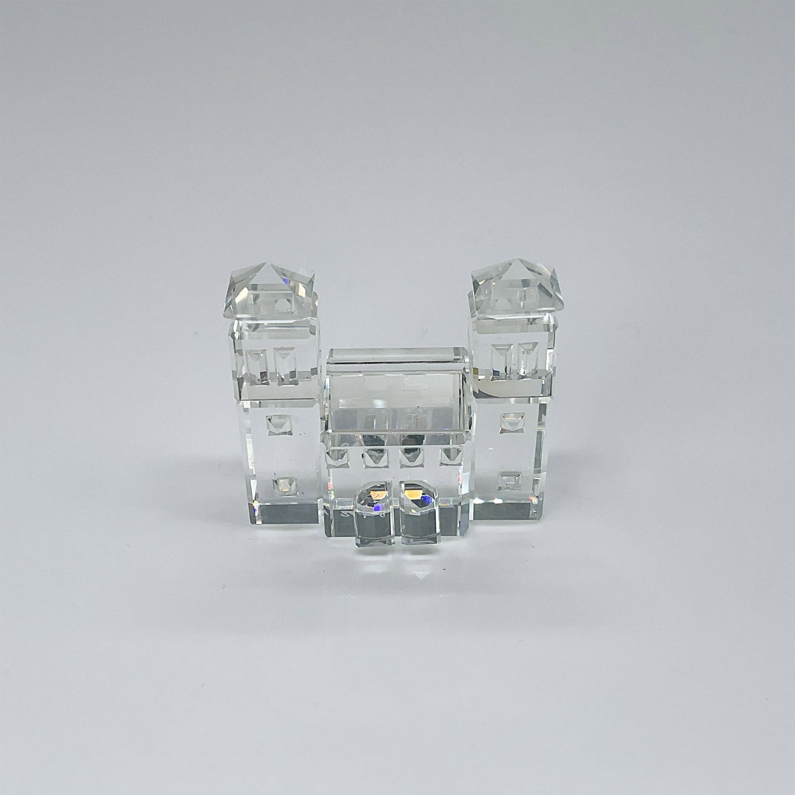 Swarovski Silver Crystal Figurine, City Gates: Lead crystal clear crystal piece that formed part of the Silver Crystal City group. Swarovski etched backstamp. This item has its original box which measures 2.5"H x 3.25" dia. Artist: Gabriel Stamey 