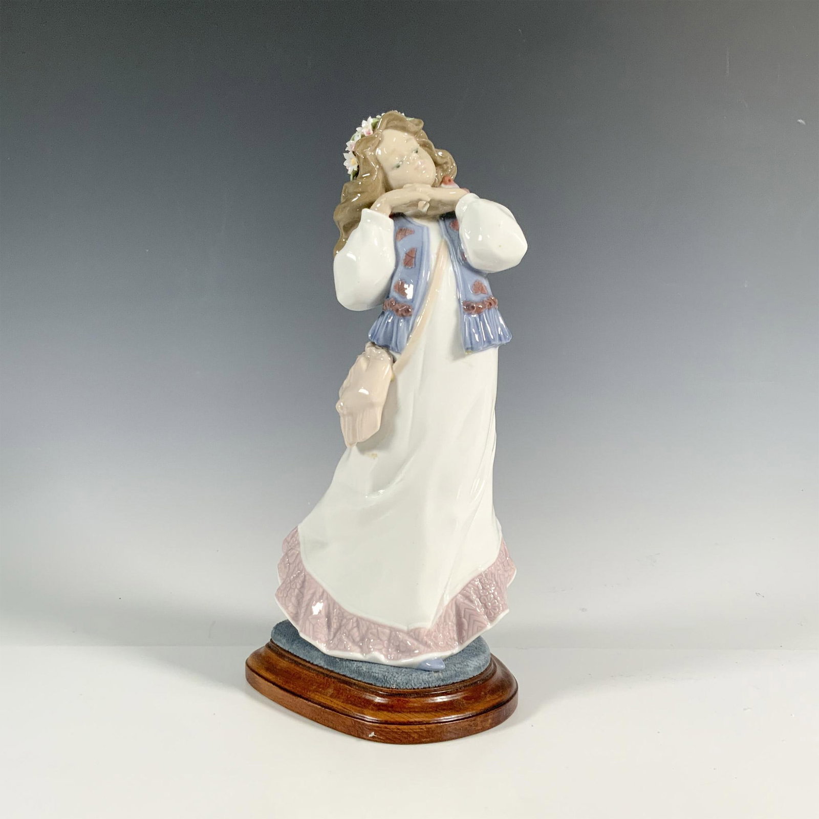 Dreams Of A Summer Past 1006401 - Lladro Porcelain Figurine: Glossy finish; Lladro backstamp. Includes original box. Includes base. Dimensions of the box: 12.75"L x 7.5"W x 5.75"H. Dimensions of the base: 5.5"L x 4.75"W x 1.25"H. Artist: Francisco Polope Issued