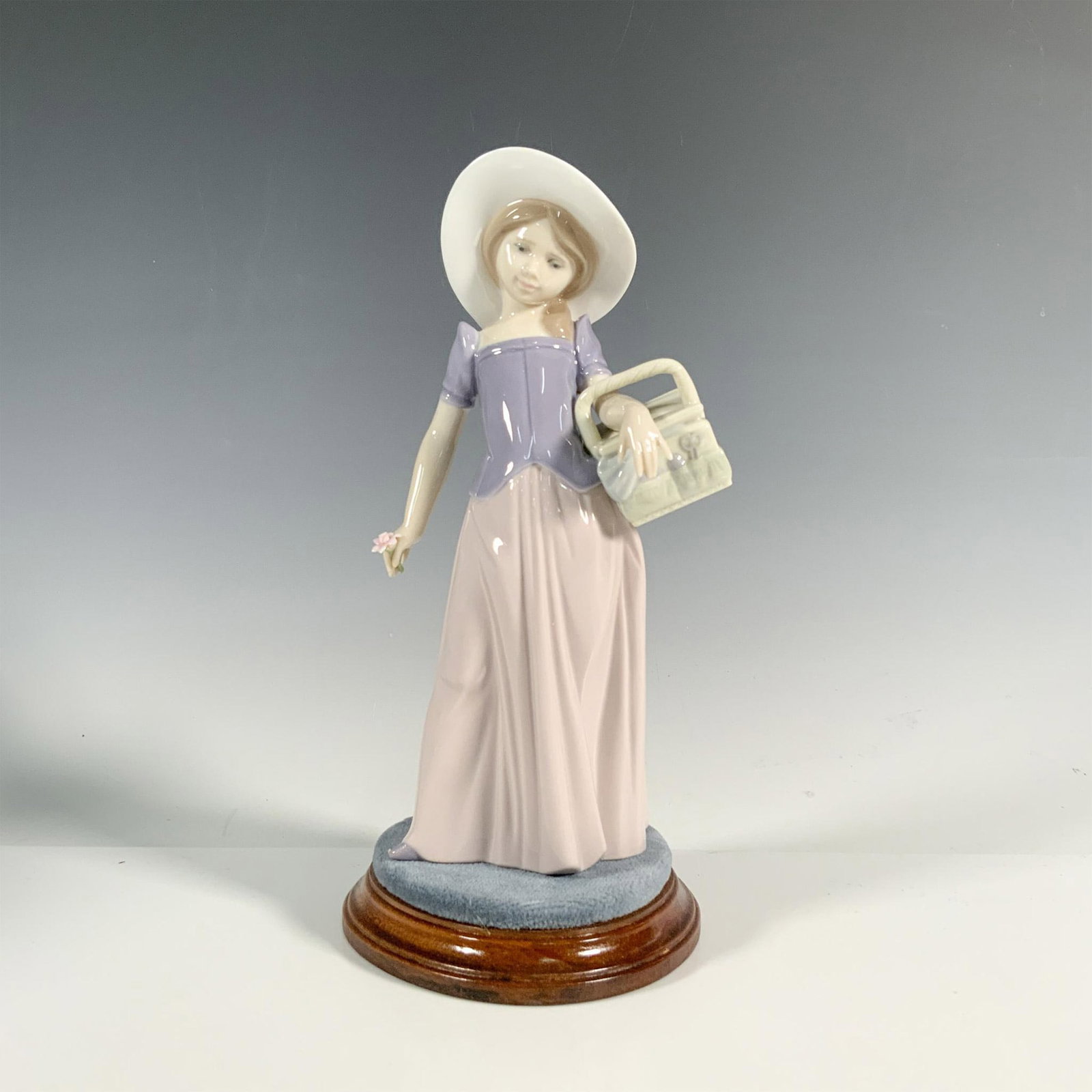 Tailor Made 1006489 - Lladro Porcelain Figurine: Glossy finish; Lladro backstamp. Includes original box. Includes base. Dimensions of the box: 10.75"L x 5.5"W x 5"H. Dimensions of the base: 4.75"L x 4.25"W x 1"H. Artist: Marco Antonio Nogueron Issue