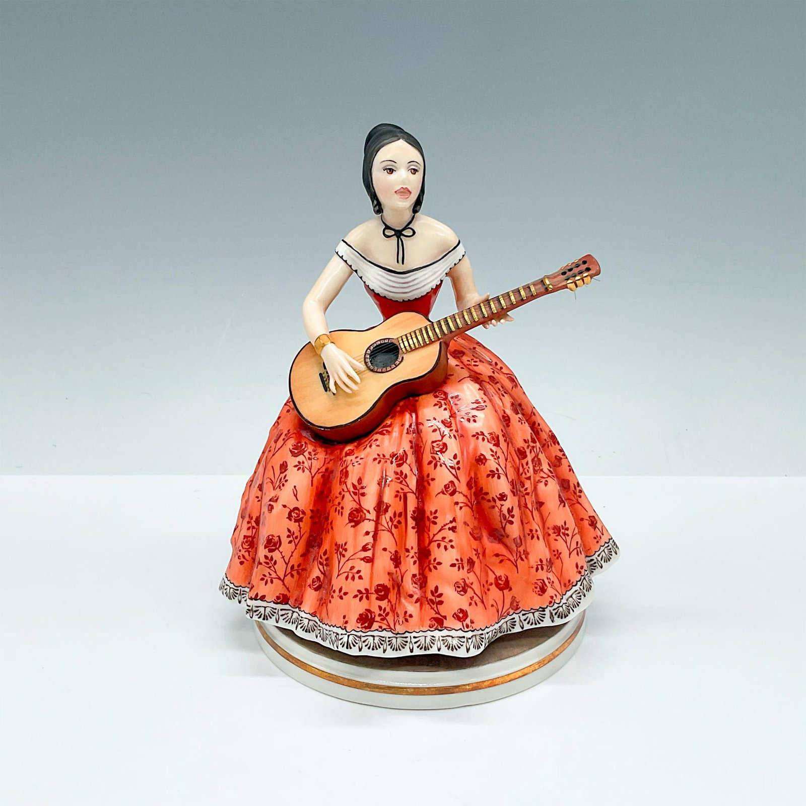 Royal Worcester Fine Bone China Figurine, Elaine: Beautifully dressed Elaine sits playing her guitar and singing along. Royal Worcester backstamp. Artist: Ronald Van Ruyckevelt Issued: 1970 Dimensions: 5"L x 4.75"W x 6"H Edition Number: 433/750 Manuf
