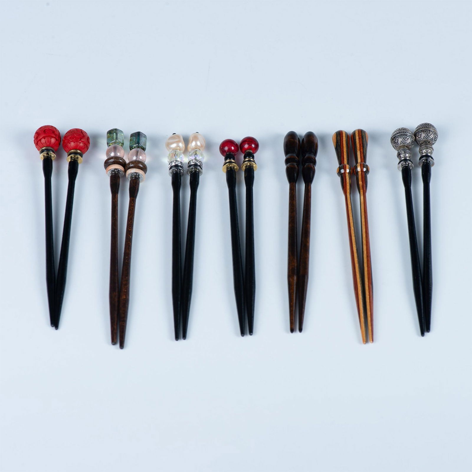 7 Pairs of Decorative Hair Sticks: Fun and fabulous wood base hair sticks. The tops are embellished with stones, metals, glass beads, crystals, pearls and wood. All unique. Five pair are backstamped Mei Fa. Mei Fa means beautiful hair