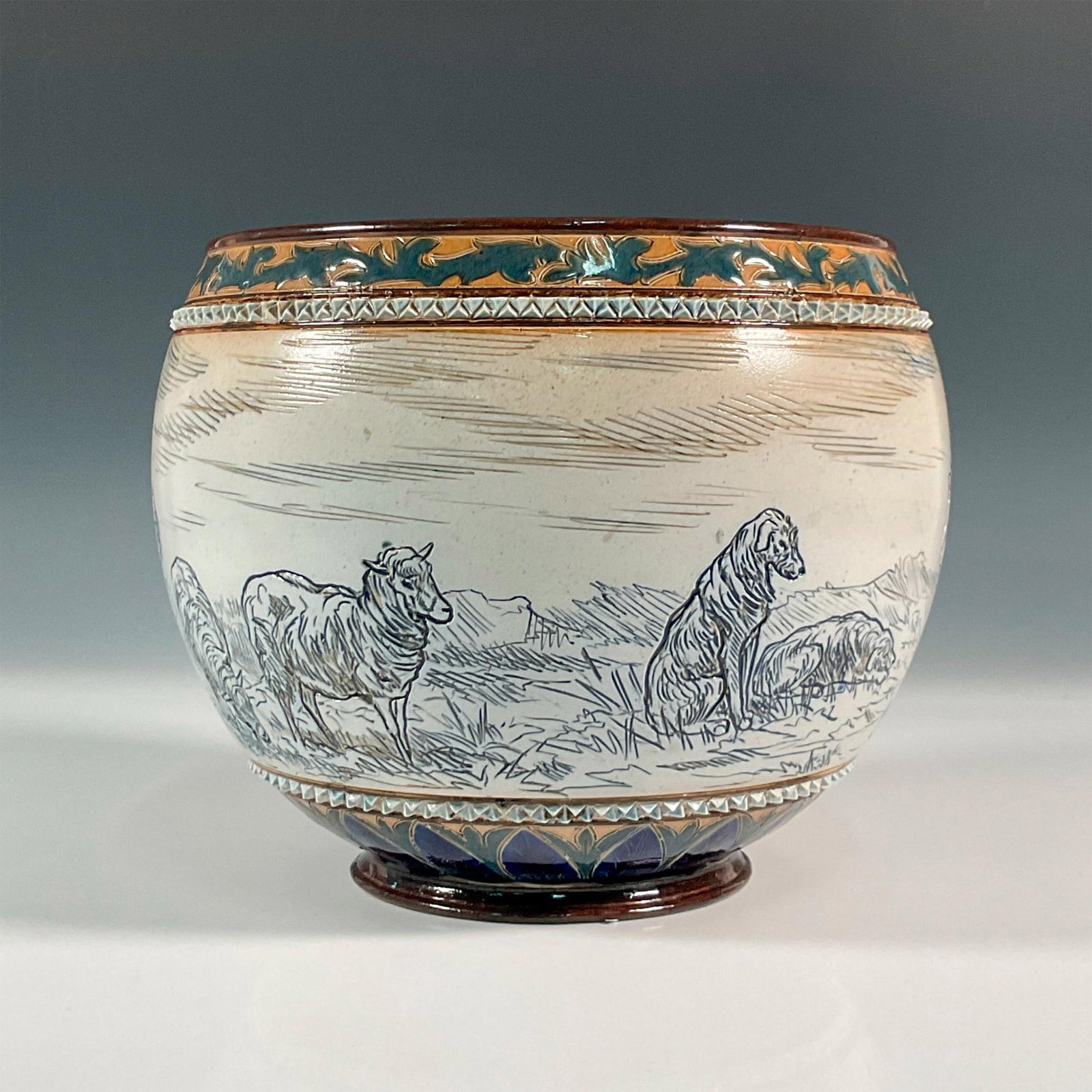 Doulton Lambeth Hannah and Lucy Barlow Stoneware Jardiniere: Delightful stoneware jardiniere in glazed finish, incised with a large band of ponies, sheep, and two resting dogs, surrounded by foliate borders and white beaded pattern. Incised artist assistant and