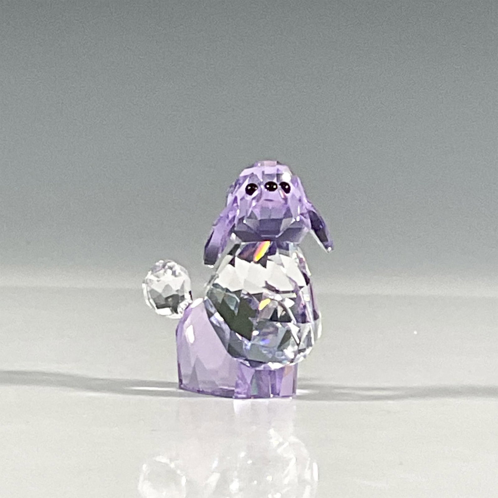 Swarovski Crystal Figurine, Violetta Poodle: Lead violet and clear crystal figure poodle limited edition 2008 piece. From the Lovlot Gang, the only lady in the gang of dogs. Swarovski etched backstamp. Artist: Stefanie Nederegger Issued: 2008 Di